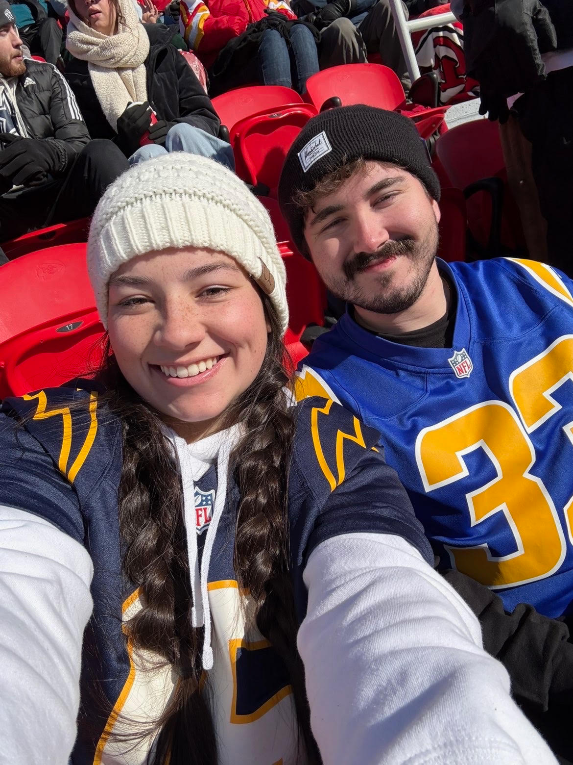 Jayden and Kyle smiling together at a football game